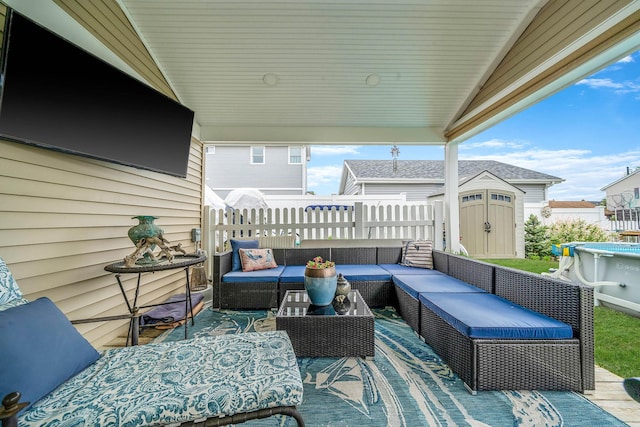 510 Fire Island Ave, Babylon, NY 11702 - view of patio / terrace with outdoor lounge area, a storage unit, fence, and an outbuilding
