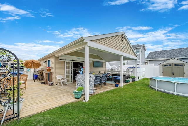 510 Fire Island Ave, Babylon, NY 11702 - back of house featuring a wooden deck, a storage shed, an outbuilding, and an outdoor hangout area