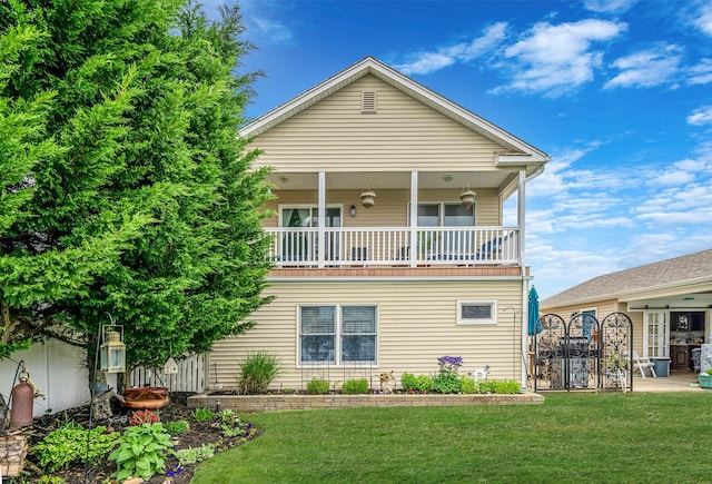 510 Fire Island Ave, Babylon, NY 11702 - rear view of property featuring a lawn and a balcony