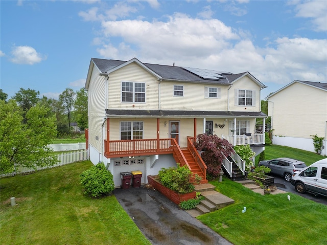 1 Alicia Ln, Warwick, NY 10990 - view of front facade featuring covered porch, a garage, driveway, roof mounted solar panels, and stairway
