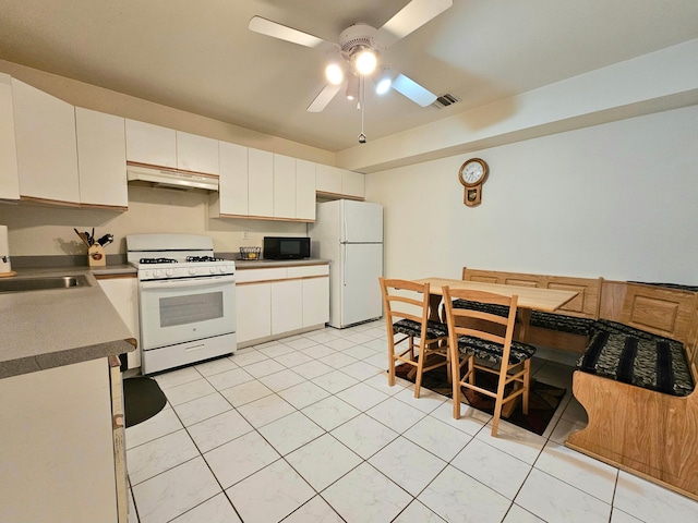 53 Olde Wagon Rd Unit 53, Warwick, NY 10990 - kitchen featuring white appliances, under cabinet range hood, a ceiling fan, a sink, and white cabinetry