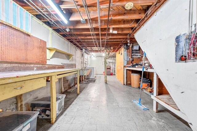 121-32 234th St, Laurelton, NY 11422 - unfinished below grade area featuring a workshop area and washer / clothes dryer