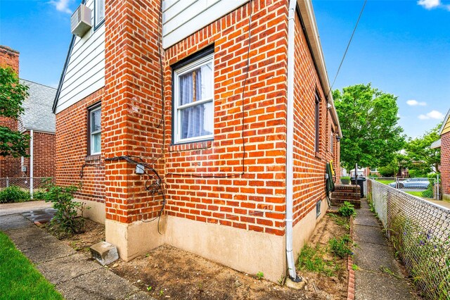 121-32 234th St, Laurelton, NY 11422 - view of side of home featuring brick siding