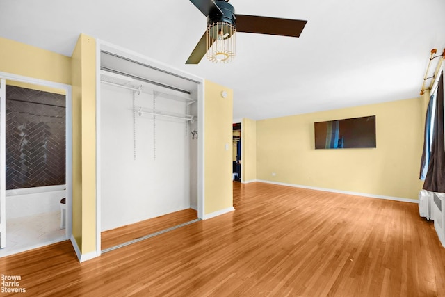 2015 Saint Paul Ave Unit 3H, Bronx, NY 10461 - unfurnished bedroom with a closet, light wood-style flooring, a ceiling fan, and baseboards