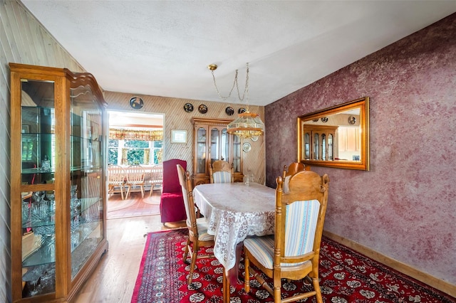 9 Forest Rd, Kings Park, NY 11754 - dining space featuring wood finished floors and wallpapered walls