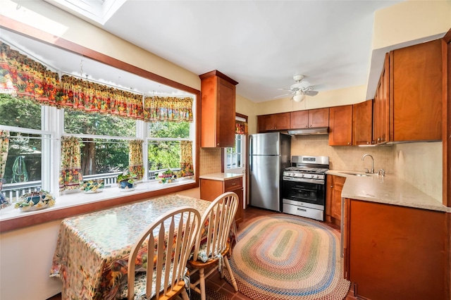 9 Forest Rd, Kings Park, NY 11754 - kitchen with stainless steel appliances, a sink, tasteful backsplash, under cabinet range hood, and ceiling fan