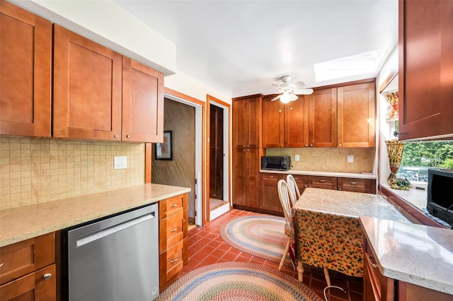 9 Forest Rd, Kings Park, NY 11754 - kitchen featuring stainless steel dishwasher, black microwave, a skylight, backsplash, and light stone countertops