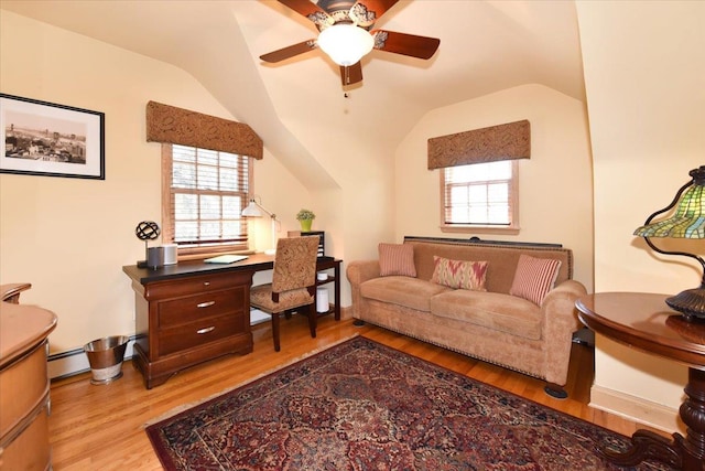 1515 Lowell Ave, New Hyde Park, NY 11040 - sitting room featuring vaulted ceiling, light wood finished floors, a ceiling fan, baseboard heating, and an office area