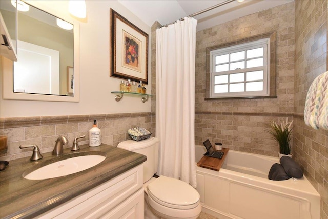 1515 Lowell Ave, New Hyde Park, NY 11040 - bathroom with tile walls, toilet, vanity, shower / bathtub combination with curtain, and a wainscoted wall