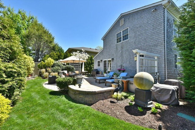 1515 Lowell Ave, New Hyde Park, NY 11040 - rear view of property featuring a patio and a lawn