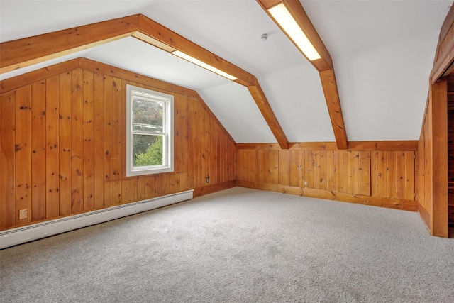 bonus room with baseboard heating, vaulted ceiling, wood walls, and carpet flooring