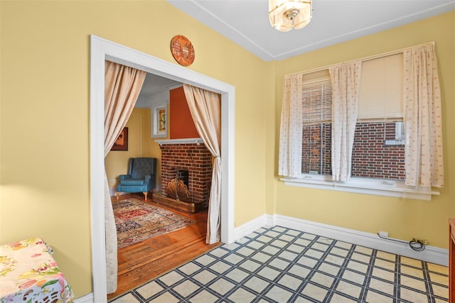 332 E 240th St, Bronx, NY 10470 - interior space with baseboards and a brick fireplace