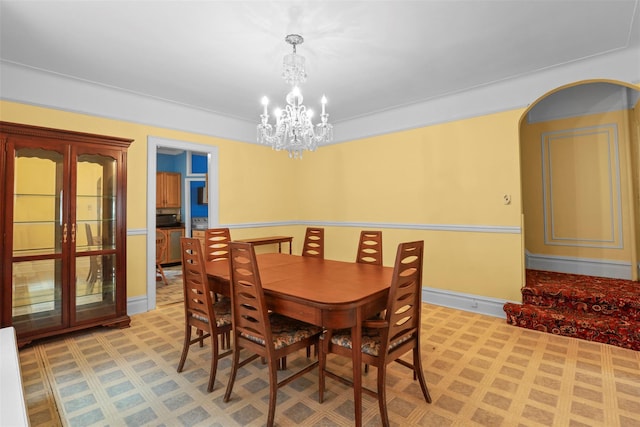 332 E 240th St, Bronx, NY 10470 - dining area featuring a chandelier, baseboards, and light floors