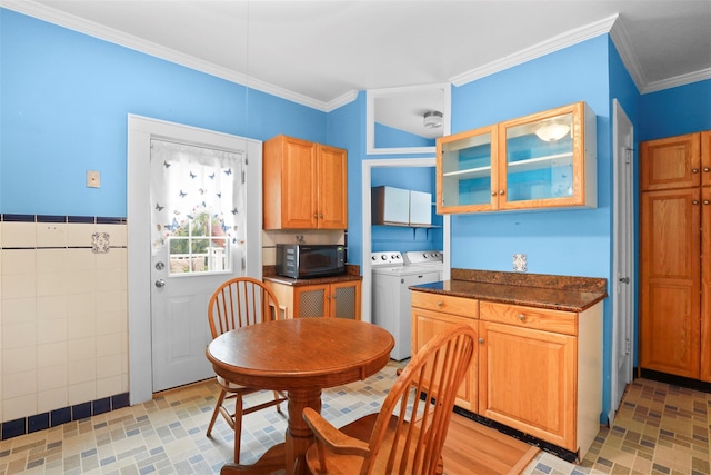 332 E 240th St, Bronx, NY 10470 - dining room with independent washer and dryer, ornamental molding, and tile walls