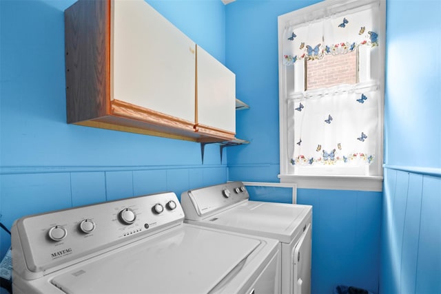 332 E 240th St, Bronx, NY 10470 - laundry room with cabinet space, washer and dryer, and a wainscoted wall