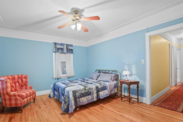 332 E 240th St, Bronx, NY 10470 - bedroom with hardwood / wood-style floors, baseboards, and a ceiling fan