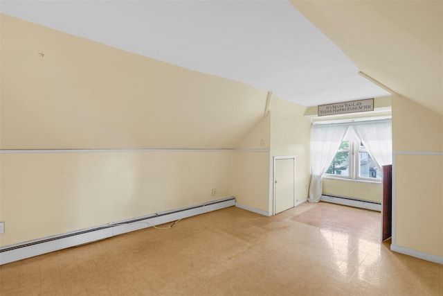 332 E 240th St, Bronx, NY 10470 - bonus room with baseboard heating, vaulted ceiling, baseboards, and tile patterned floors