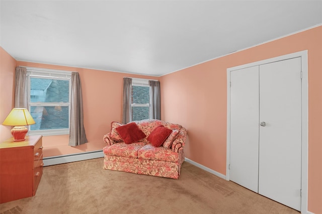 332 E 240th St, Bronx, NY 10470 - sitting room featuring a baseboard radiator, carpet floors, and baseboards