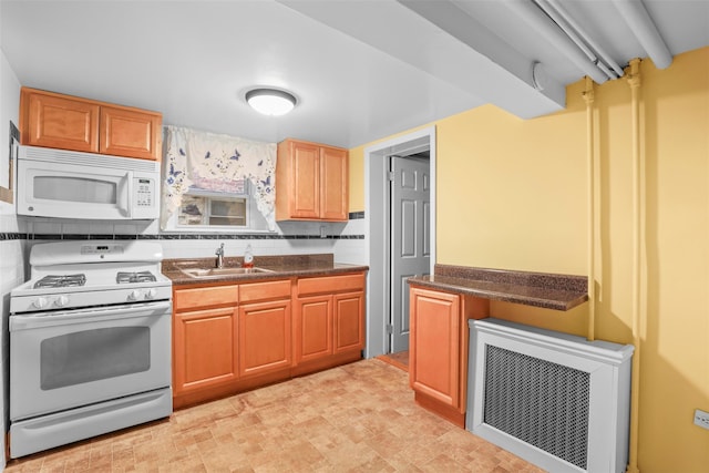 332 E 240th St, Bronx, NY 10470 - kitchen featuring white appliances, a sink, dark countertops, heating unit, and tasteful backsplash