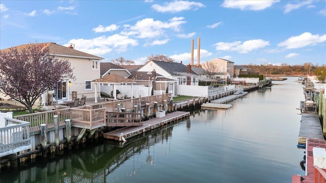 dock featuring a deck with water view and a residential view