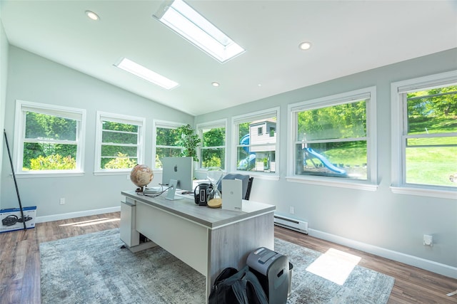 21 Grayon Dr, Dix Hills, NY 11746 - office space featuring a skylight, vaulted ceiling, baseboard heating, plenty of natural light, and wood finished floors
