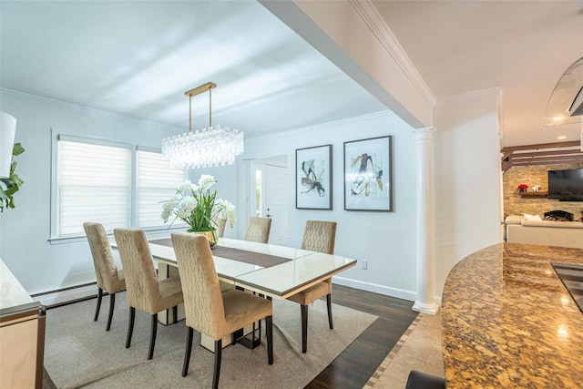 21 Grayon Dr, Dix Hills, NY 11746 - dining room with baseboard heating, ornate columns, ornamental molding, a chandelier, and baseboards