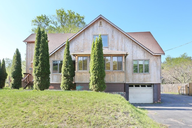 1143 State Route 17b, Mongaup Valley, NY 12762 - view of front of home with an attached garage, driveway, and a shingled roof