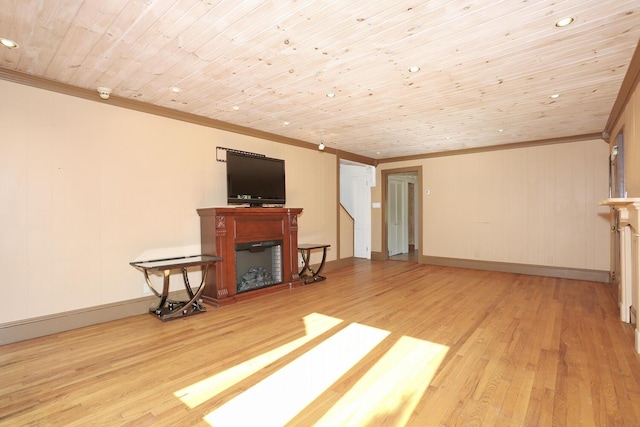 1143 State Route 17b, Mongaup Valley, NY 12762 - unfurnished living room featuring crown molding, light wood-style floors, a fireplace, baseboards, and wooden ceiling