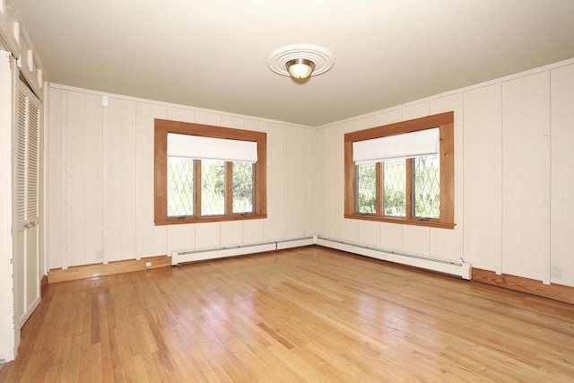 1143 State Route 17b, Mongaup Valley, NY 12762 - spare room featuring light wood finished floors, plenty of natural light, and baseboard heating