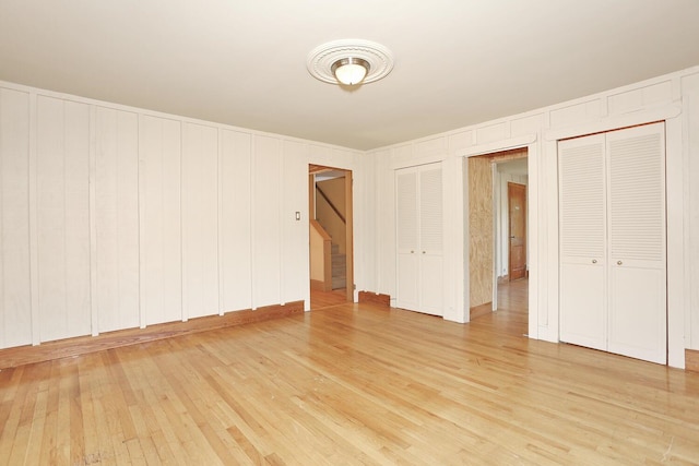 1143 State Route 17b, Mongaup Valley, NY 12762 - unfurnished bedroom with two closets and light wood-style flooring