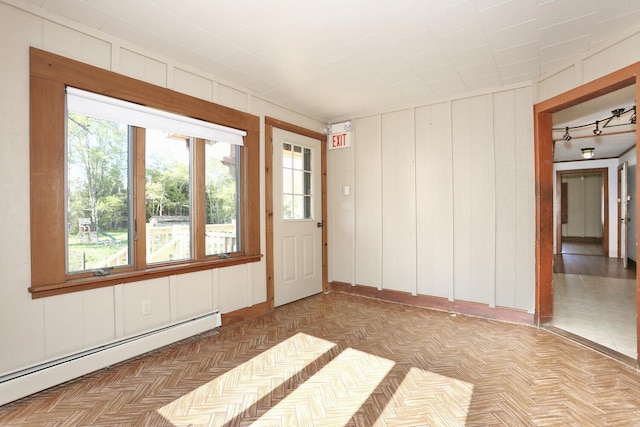 1143 State Route 17b, Mongaup Valley, NY 12762 - empty room featuring a baseboard heating unit, plenty of natural light, and wooden walls