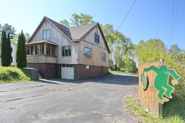 1143 State Route 17b, Mongaup Valley, NY 12762 - view of home's exterior with a garage and asphalt driveway