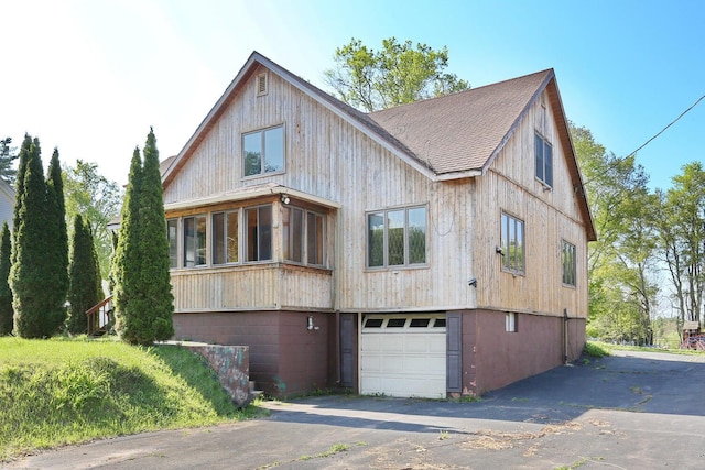 1143 State Route 17b, Mongaup Valley, NY 12762 - back of house featuring asphalt driveway, an attached garage, and a shingled roof