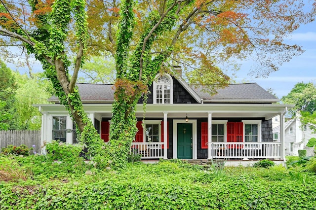 60 Revolutionary Rd, Ossining, NY 10562 - view of front of property featuring roof with shingles, a porch, and fence