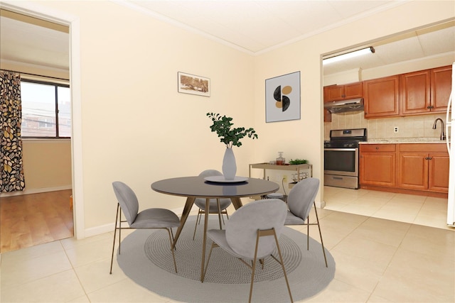 14428 Barclay Ave Unit 2C, Flushing, NY 11355 - dining room with ornamental molding, light tile patterned floors, and baseboards