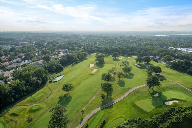 aerial view of property and surrounding area featuring a local golf course
