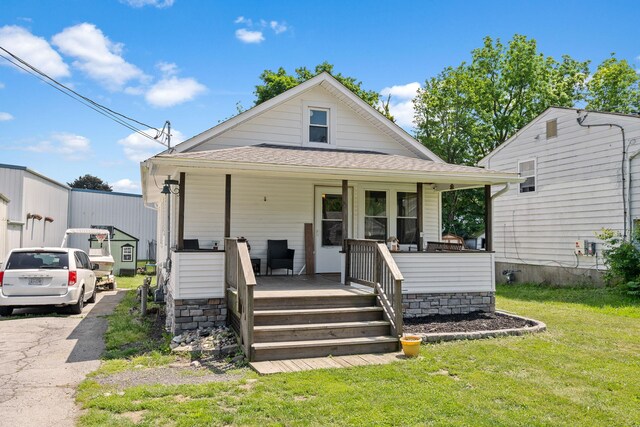 108 Homestead Ave, Maybrook, NY 12543 - view of front of property featuring a porch, a front yard, and a shingled roof