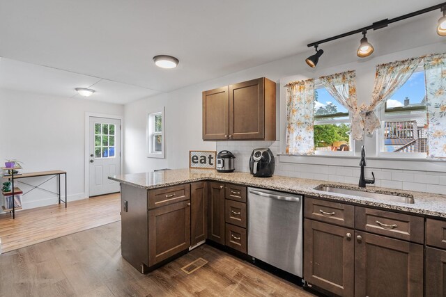 108 Homestead Ave, Maybrook, NY 12543 - kitchen with stainless steel dishwasher, a sink, a peninsula, and dark wood finished floors