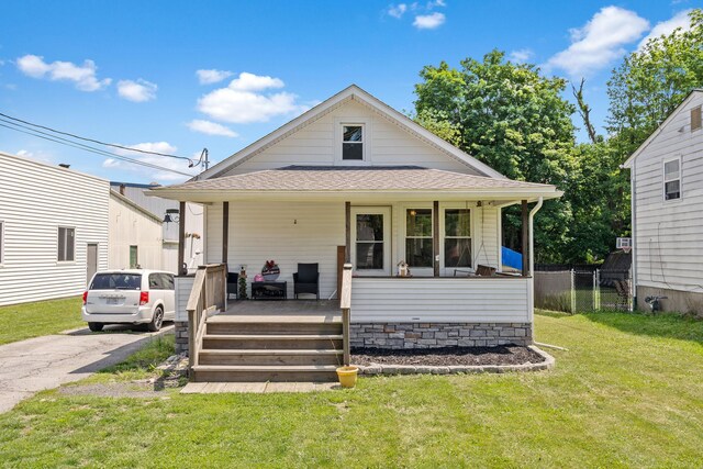 108 Homestead Ave, Maybrook, NY 12543 - view of front of house with covered porch, a front lawn, and roof with shingles