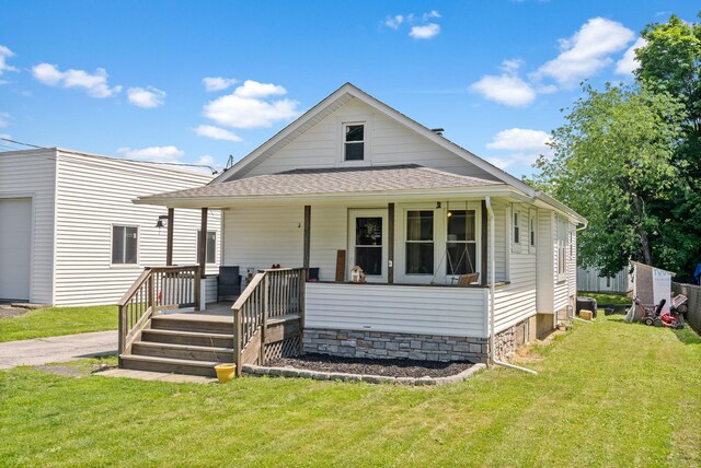 108 Homestead Ave, Maybrook, NY 12543 - view of front of home with a front yard, a shingled roof, and covered porch