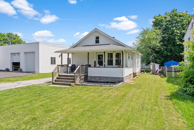 108 Homestead Ave, Maybrook, NY 12543 - view of front of property with a garage, a porch, an outbuilding, and a shingled roof