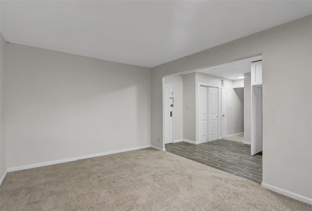 below grade area with carpet flooring and baseboards