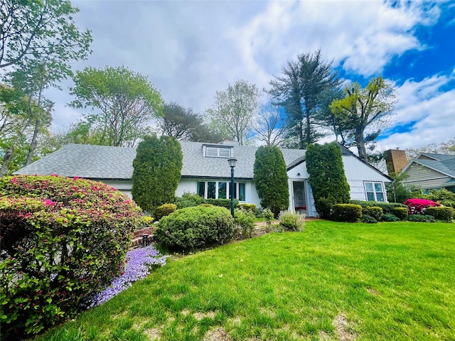 21 Rivers Dr, Great Neck, NY 11020 - view of front facade featuring a front yard and a shingled roof