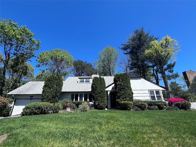 21 Rivers Dr, Great Neck, NY 11020 - view of front of house featuring a garage, a front yard, and roof with shingles