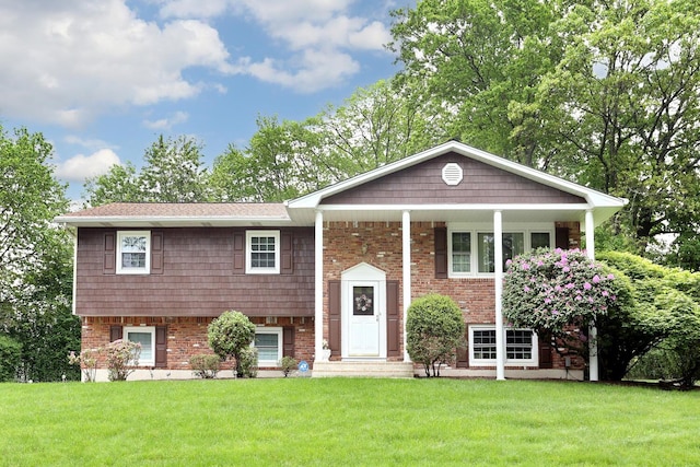4 Stockbridge Ave, Suffern, NY 10901 - raised ranch with a front yard and brick siding