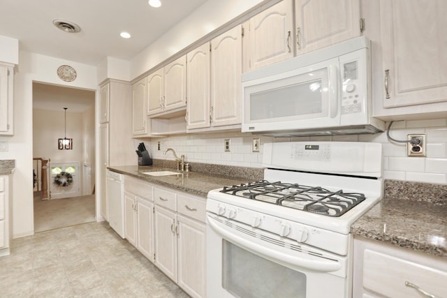 4 Stockbridge Ave, Suffern, NY 10901 - kitchen with white appliances, a sink, tasteful backsplash, light stone counters, and recessed lighting