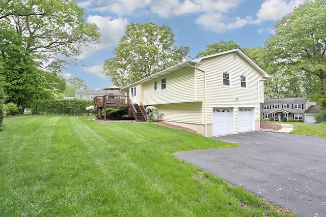4 Stockbridge Ave, Suffern, NY 10901 - view of property exterior featuring stairway, a deck, a garage, driveway, and a yard