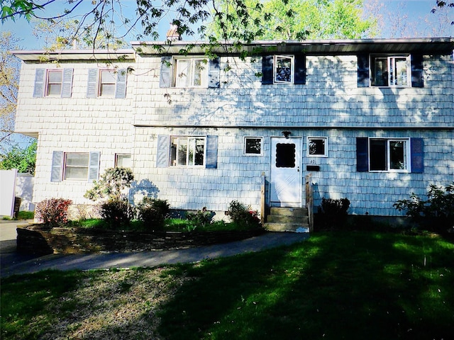 40 Kent Ln, Centereach, NY 11720 - view of front of home featuring entry steps and a front lawn