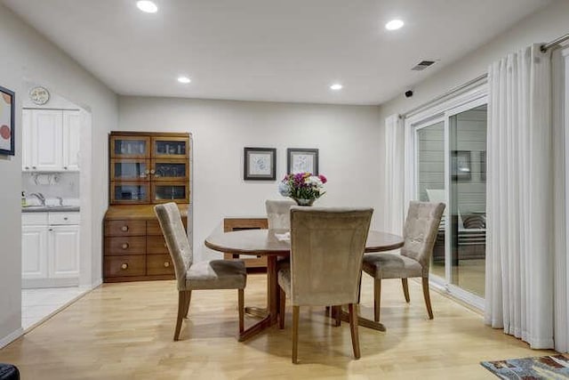 141 Southgate Dr, Massapequa Park, NY 11762 - dining area featuring light wood-style floors and recessed lighting