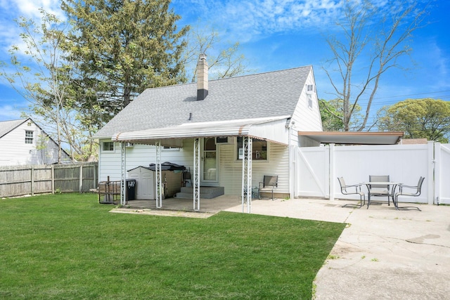 187 Mark Tree Rd, Centereach, NY 11720 - rear view of house with a patio, a shingled roof, and a chimney